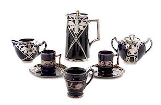 * An Art Nouveau Assembled Silver Overlay Porcelain Tea Set, Height of tallest 7 1/2 inches.
