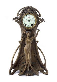 * An American Cast Metal Art Nouveau Figural Clock, Height 18 1/8 inches.