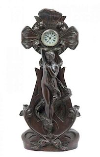 * An Art Nouveau Copper Clad Figural Clock, Height 22 3/4 inches.