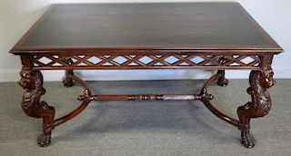Highly Carved Mahogany Leathertop Table.