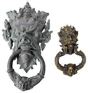 Two Bronze Mask Form Door Knockers