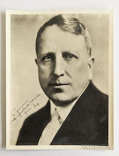 Hearst, William Randolph (1863-1951) Large Signed Photograph. Sepia-toned photographic portrait of Hearst in a suit and tie,