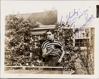 Power, Tyrone (1914-1958) Signed Photograph. Black-and-white photograph of Power playing table tennis, signed in blue ink, fo