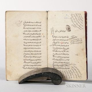 Arabic Manuscript on Paper, Commentary on Porphyry. Small octavo manuscript in black and red ink on paper, bound in limp leat