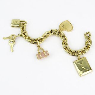 Louis Vuitton Heavy 18 Karat Yellow Gold and Pink Quartz Charm Bracelet with Four Charms.