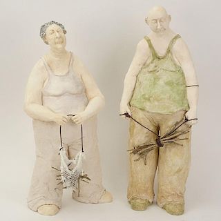 Two Contemporary Pottery Figures. Man And Woman With Sticks.