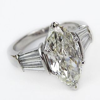 GIA Certified 3.09 Carat Marquise Cut Diamond and Platinum Engagement Ring accented with approx. 1.20 Carat Tapered Baguette
