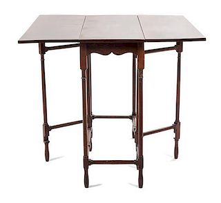 An English Mahogany Spider-Leg Drop Leaf Table Height 27 3/4 x width 31 1/2 x depth 11 3/4 inches (closed).