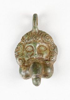 An erotic bronze amulet