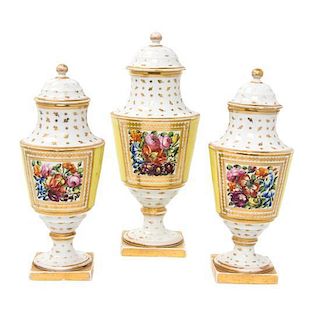 An English Porcelain Three-Piece Garniture Height 10 inches.