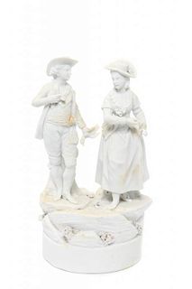 A Derby Bisque Figural Group Height 7 1/4 inches.