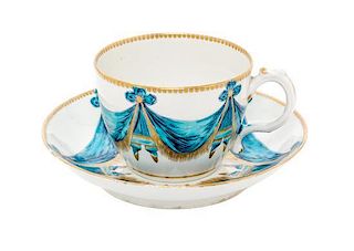 An English Porcelain Teacup and Saucer Diameter of saucer 5 7/8 inches.