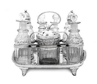 An English Silver-Plate Cruet Set, , with seven cut glass bottles and jars of various forms and sizes, three with silver covers