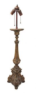 An Italian Baroque Style Pricket Stick Height 33 1/2 inches.