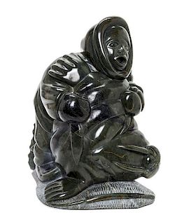 An Inuit Stone Sculpture Height 11 1/4 inches.