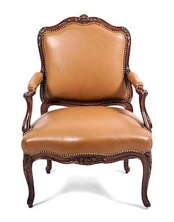 A Louis XV Carved Beechwood Fauteuil a la Reine, Height 37 x width 26 x depth 20 inches.