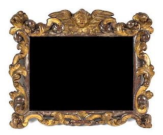 A Baroque Style Parcel Gilt Carved Wood Mirror, Height 22 x width 26 inches.