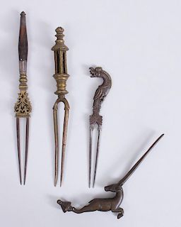 GROUP OF FOUR INDIAN BRASS, BRONZE AND METAL HAIRCOMBS