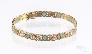 18K yellow gold, emerald and seed pearl bangle