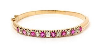 An Edwardian Yellow Gold, Ruby and Diamond Bangle Bracelet, 6.30 dwts.