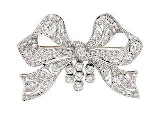A Platinum and Diamond Bow Brooch, 11.75 dwts.