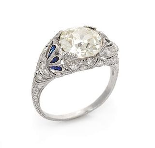 An Edwardian Platinum, Diamond and Synthetic Sapphire Ring, 3.10 dwts.