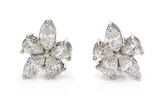 A Pair of Platinum and Diamond Cluster Earclips, 6.30 dwts.