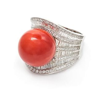 An 18 Karat White Gold, Coral and Diamond Ring, 15.30 dwts.
