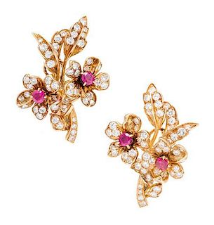 A Pair of 18 Karat Yellow Gold, Diamond, and Ruby Floral Cluster Earclips, Cartier, 8.30 dwts.