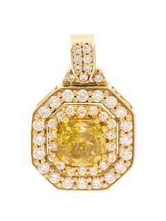 An 18 Karat Bicolor Gold, Fancy Deep Yellow Diamond and Diamond Pendant, 8.00 dwts.