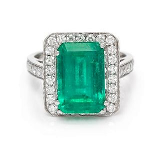 An 18 Karat White Gold, Emerald and Diamond Ring, 3.80 dwts.