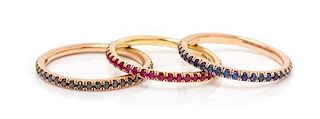 A Collection of 18 Karat Gold, Ruby, Sapphire and Black Diamond Stacking Eternity Bands, Sam Lehr, 3.10 dwts.
