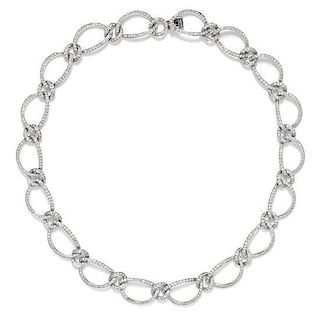 An 18 Karat White Gold and Diamond Oval Link Necklace, 26.10 dwts.