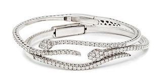 A Pair of White Gold and Diamond Serpent Motif Bangle Bracelets, 22.50 dwts.