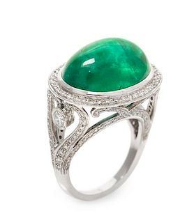 An 18 Karat White Gold, Emerald and Diamond Ring, 7.90 dwts.