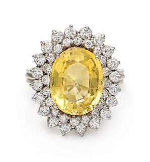 A 14 Karat White Gold, Yellow Sapphire and Diamond Ring, 4.40 dwts.