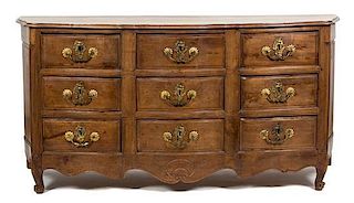 A Louis XV Provincial Style Carved Walnut Nine Drawer Serpentine Commode