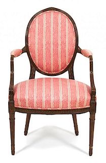 A Louis XVI Style Carved Mahogany Fauteuil