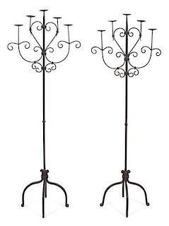 A Pair of Wrought Iron Five-Light Torcheres Height 63 1/2 inches.