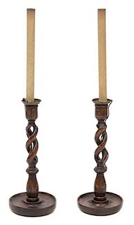 A Pair of Walnut Barley Twist Candlesticks Overall height 26 inches.