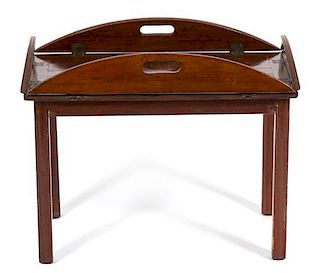 An English Mahogany Butler's Tray on Stand Height 17 3/4 x width 32 1/2 x depth 23 3/4 inches.