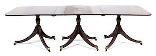 A Regency Style Three Pedestal Dining Table