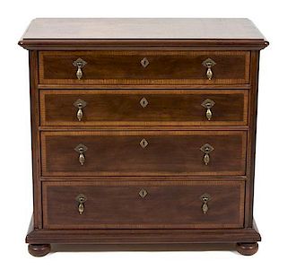 A Chippendale Style Mahogany Chest of Drawers Height 35 1/2 x width 38 3/4 x depth 20 inches.