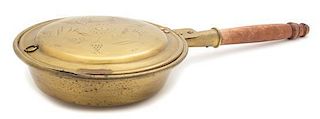 An American Embossed Brass Bed Warmer