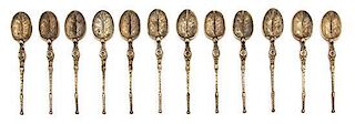 A Set of Twelve English Silver Demitasse Spoons, Thomas Bradbury & Sons, Sheffield, 1936, having turned handle and foliate-fo