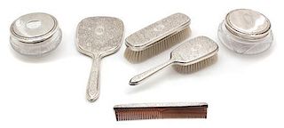 An English Sterling Vanity Set Length of mirror 11 3/4 inches.