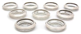 A Set of Nine American Silver Collared Glass Coasters, Frank M. Whiting & Co., North Attleboro, MA, 20th Century, with glass 