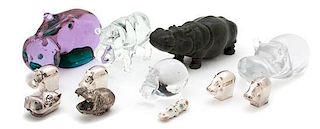 A Collection of Hippopotamus Figures Largest height 3 1/2 x width 9 1/2 x depth 3 1/2 inches.