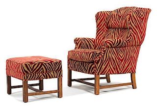 An Upholstered Wing Chair and Matching Ottoman Height of chair 41 x width 31 x depth 33 inches.