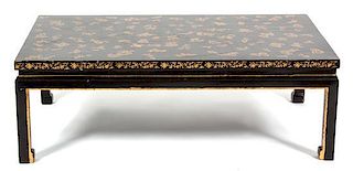 A Chinese Black and Gilt Lacquer Low Table Height 16 x width 47 1/4 x depth 29 1/2 inches.